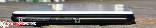 Linke Seite: AC, Mini VGA, USB 2.0 (unter Klappe), Kopfhörer/Mikrofon
