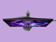Das Bild zeigt den Gaming-Monitor AOC AG276UZ vor einem violetten Hintergrund. Der Gaming-Monitor zeichnet sich durch ein sehr spielerisches Design aus, das durch RGB-Beleuchtung auf der Rückseite abgerundet wird.