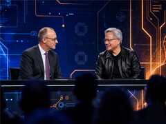 Merz und Huang sitzen an einem Tisch