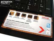 Ein großer Aufkleber bedeckt die Handballenauflage.