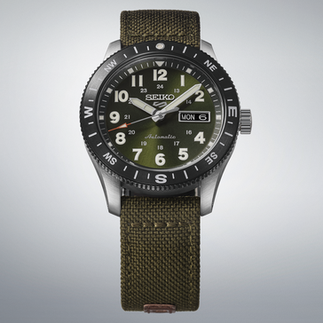 Seiko 5 Sports HDB008 field watch with green dial, black compass bezel, and green nylon strap.