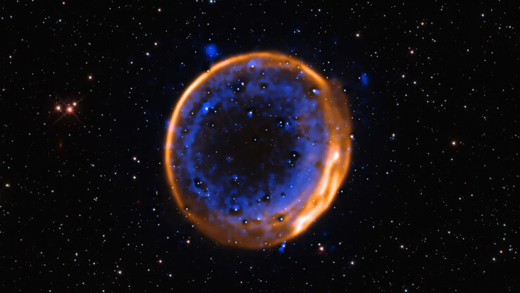 Bild der Doppeldetonations-Supernova SNR 0509-67.5, aufgenommen mit dem VLT. (Bildquelle: ESO/P. Das et al. Hintergrundsterne (Hubble): K. Noll et al.)